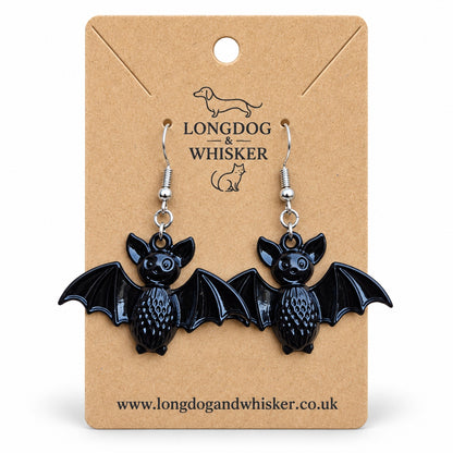 Black smiley bat earrings on a Longdog & Whisker kraft display card