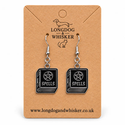 Black spellbook drop earrings on Longdog & Whisker kraft card