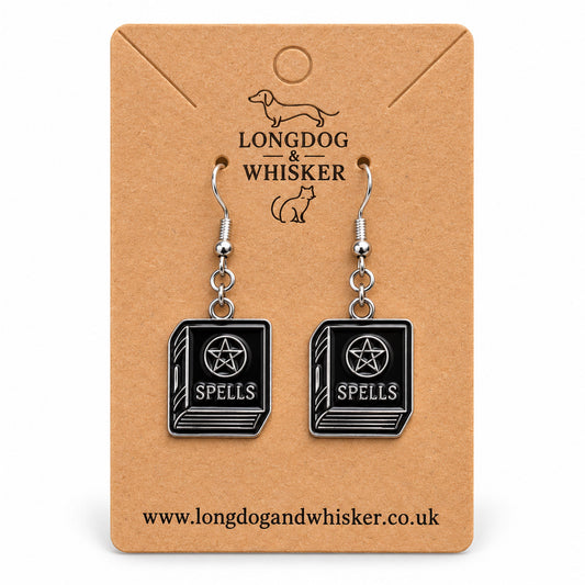 Black spellbook drop earrings on Longdog & Whisker kraft card