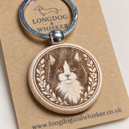 Close-up of the black and white long-haired cat wooden keyring engraving