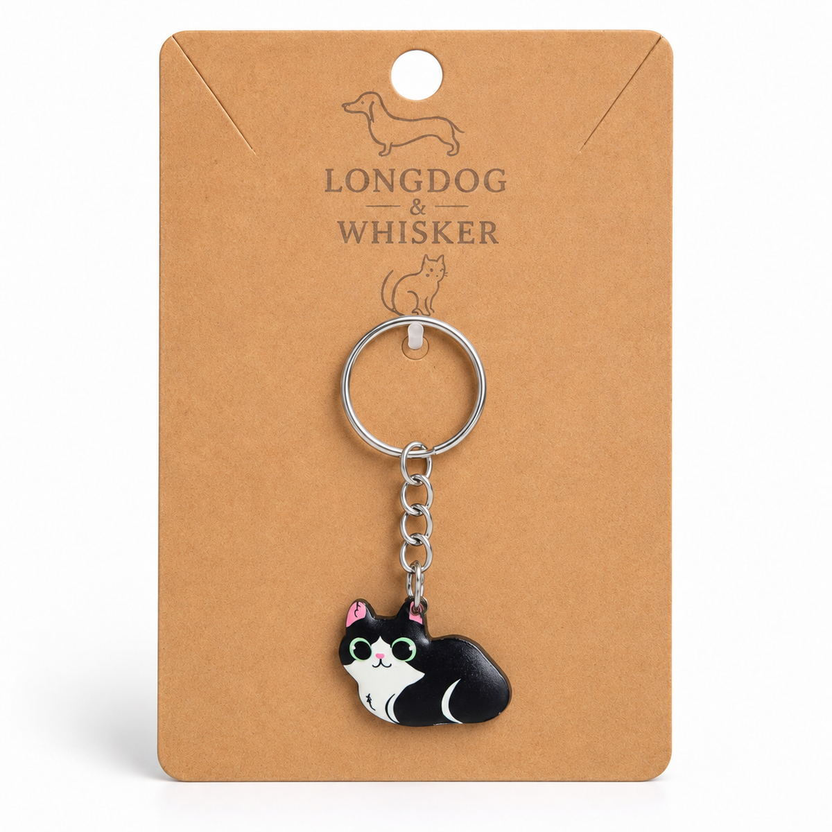 Black and white cat keyring on Longdog & Whisker display card