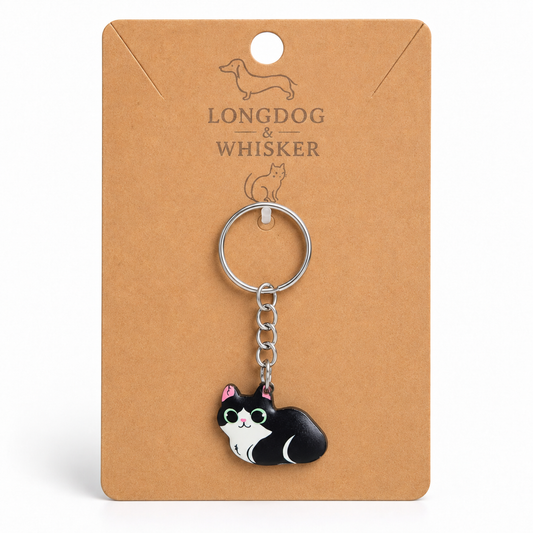 Black and white cat keyring on Longdog & Whisker display card