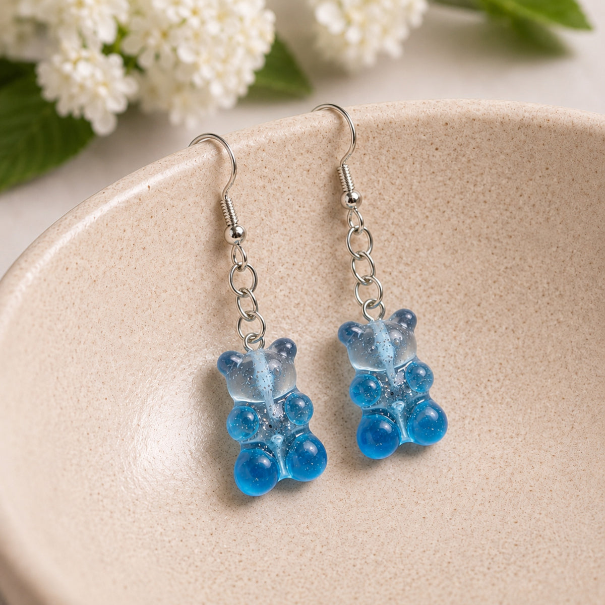 Gummy Bear Earrings - Blue displayed in a lifestyle product photo