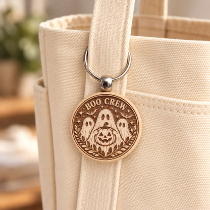 Boo Crew ghosts wooden keyring attached to a cream canvas tote bag