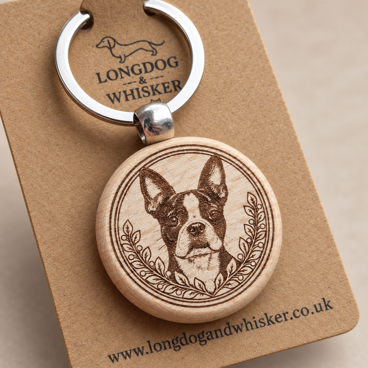 Close-up of Boston Terrier portrait, leafy border, natural wood edge and silver connector