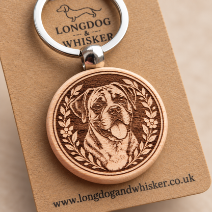 Close-up of the printed Boxer wooden keyring and silver-tone hardware