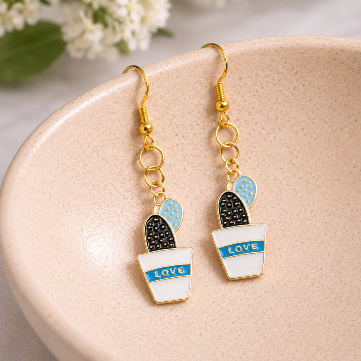 Cacti Love Earrings displayed in a lifestyle product photo