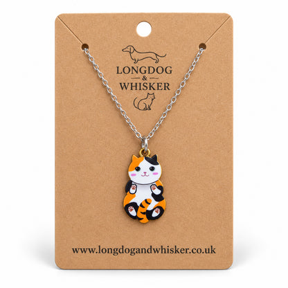 Calico Belly Rub Cat Necklace on a silver-tone chain displayed on a Longdog & Whisker kraft card