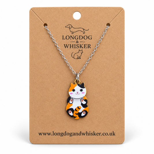 Calico Belly Rub Cat Necklace on a silver-tone chain displayed on a Longdog & Whisker kraft card