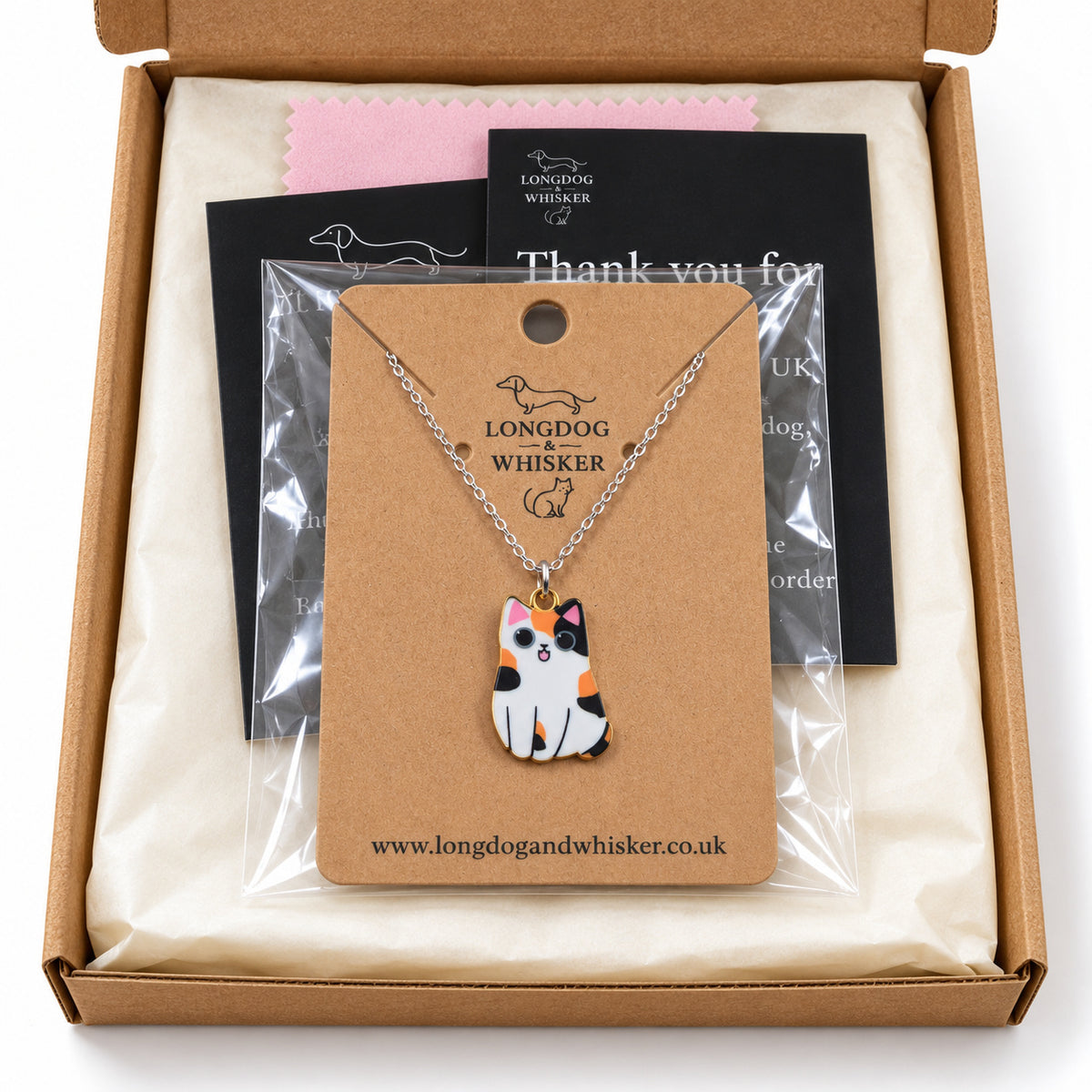 Calico chonky cat necklace on its card in Longdog & Whisker gift-ready packaging
