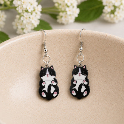 Belly Rub Cat Earrings - Black & White displayed in a lifestyle product photo