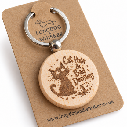 Close-up of Cat Hair and Bad Decisions engraving and rounded wooden keyring edge