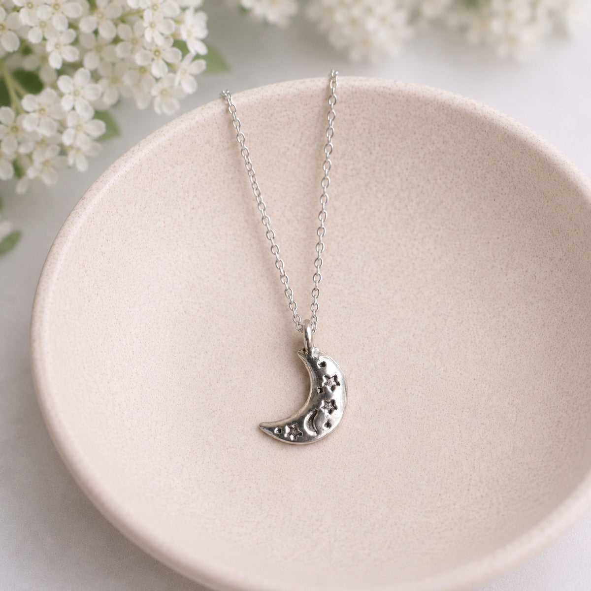 Celestial Moon Necklace in bowl lifestyle photo