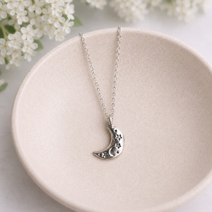 Celestial Moon Necklace in bowl lifestyle photo