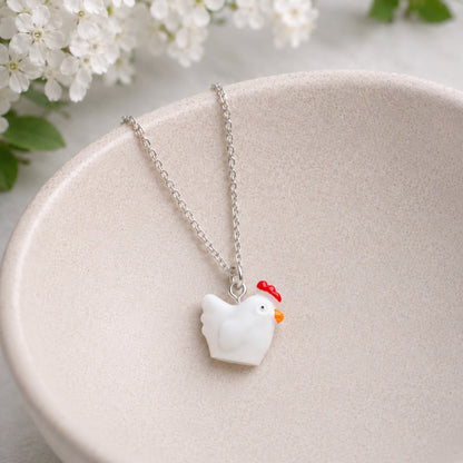 Chicken Necklace displayed in a ceramic bowl