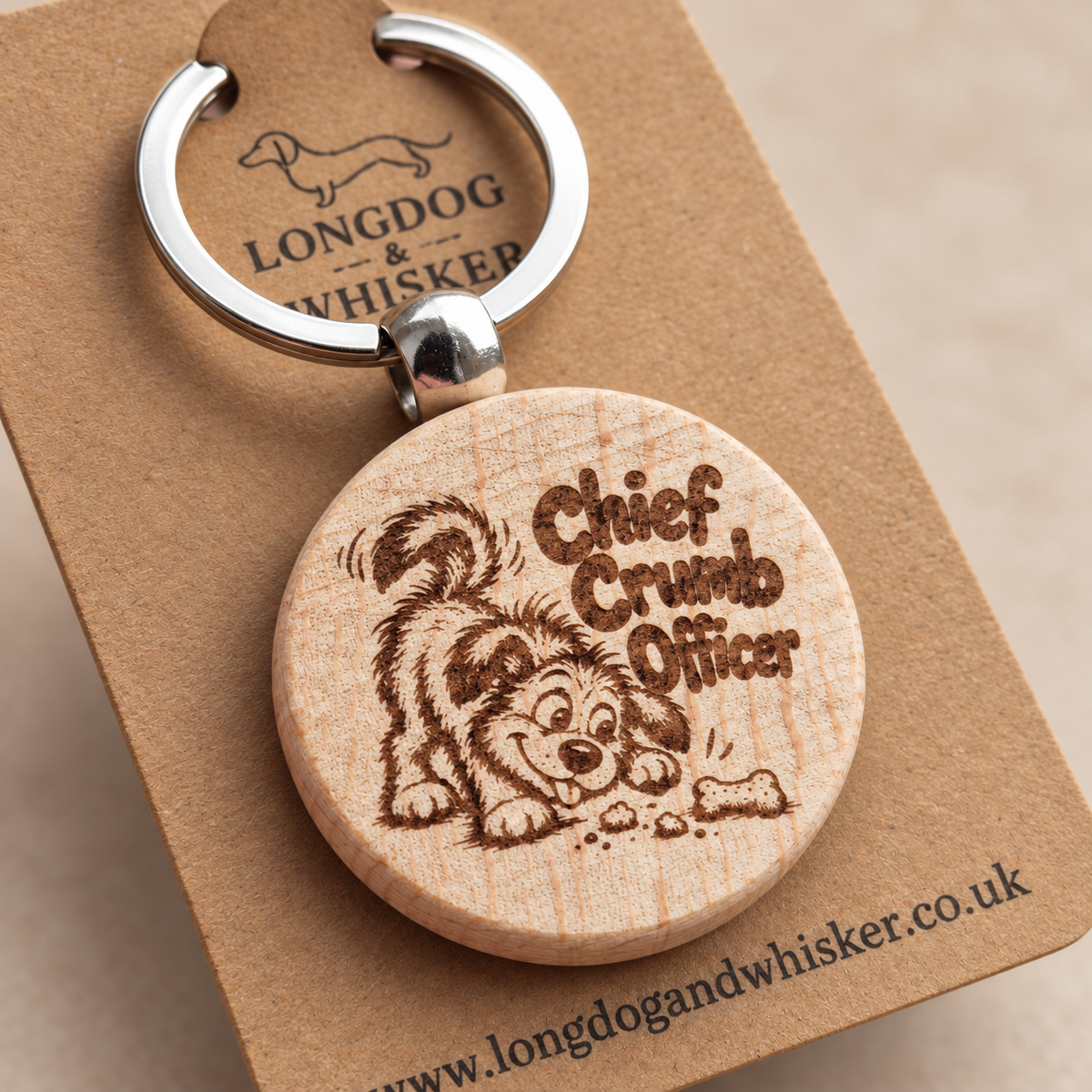 Close-up of Chief Crumb Officer dog engraving, natural wood edge and silver-tone connector