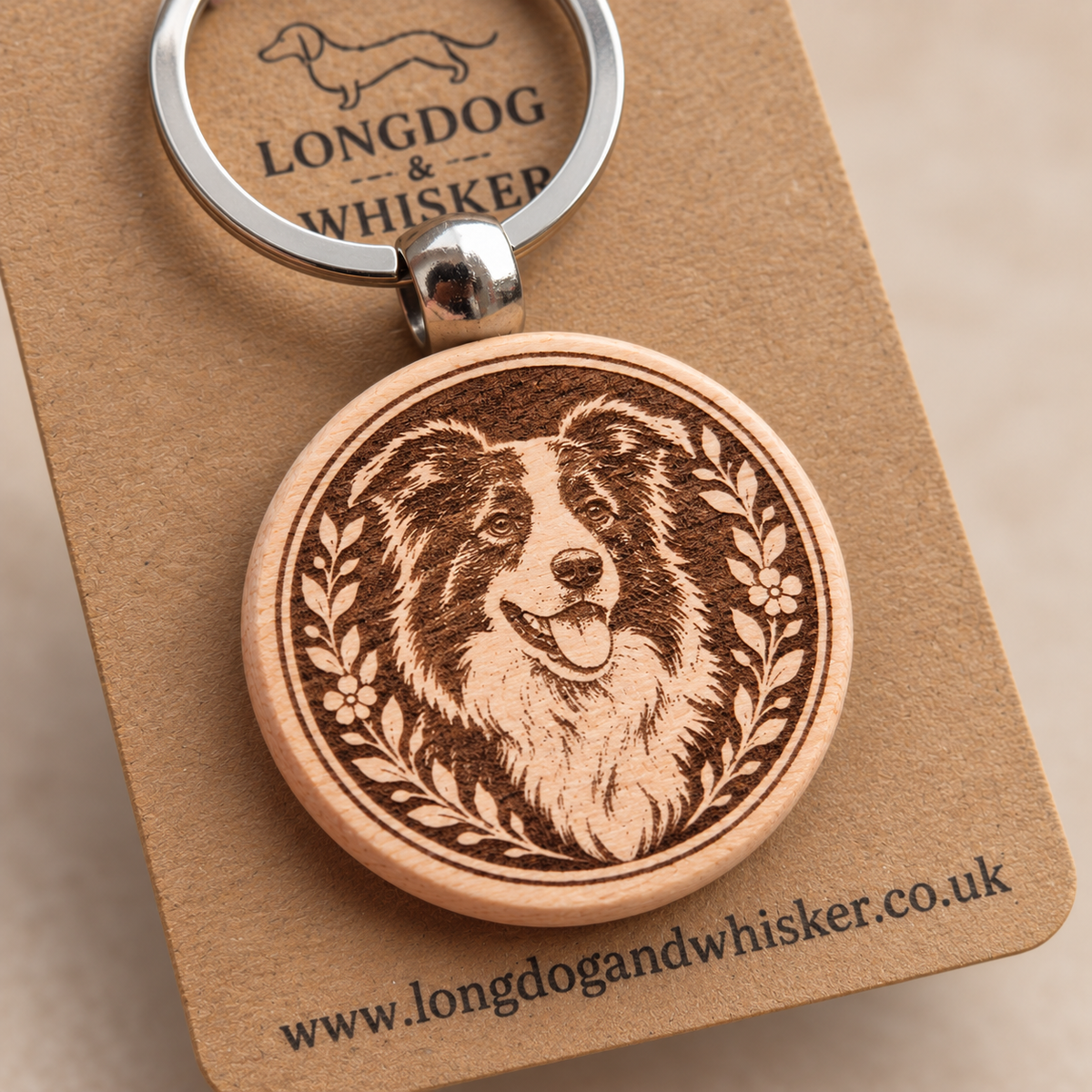 Close-up of the printed Collie wooden keyring and silver-tone hardware