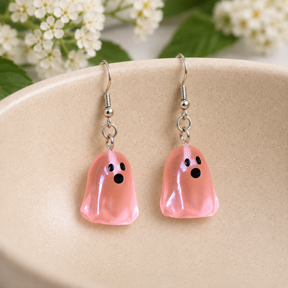 Coral Ghost Earrings arranged in a ceramic bowl