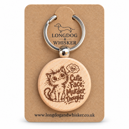 Cute Face Murder Thoughts cat wooden keyring on a Longdog & Whisker card