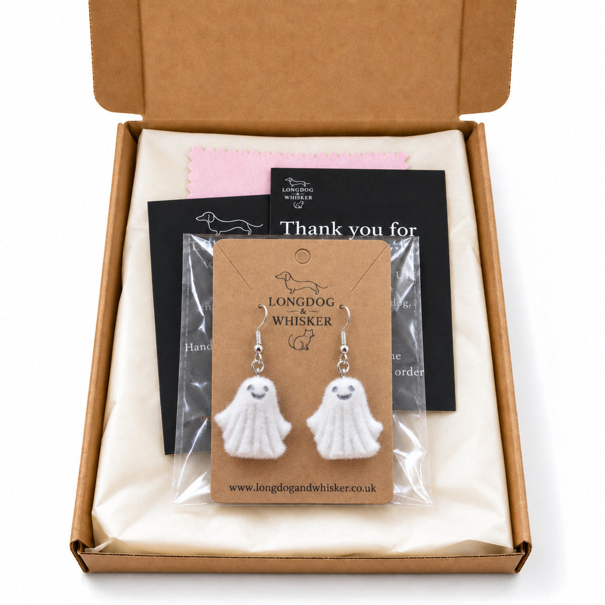 Dancing Ghost Earrings in a clear sleeve within a Longdog & Whisker gift-ready postal box