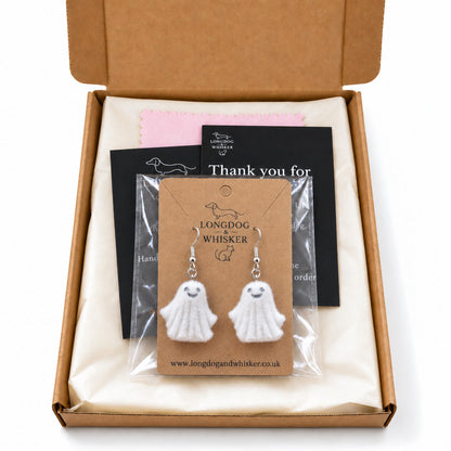 Dancing Ghost Earrings in a clear sleeve within a Longdog & Whisker gift-ready postal box