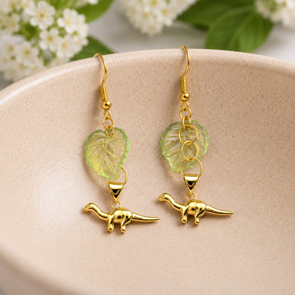 Small Dippy Dinosaur Earrings - Gold Hook displayed in a lifestyle product photo