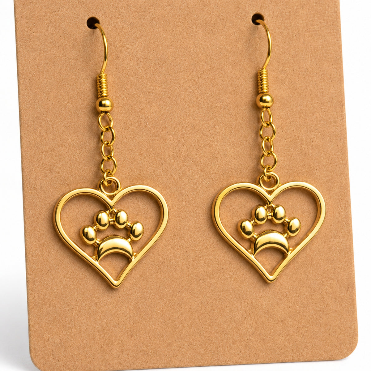 Close-up detail of Gold Heart Dog Paw Print Earrings
