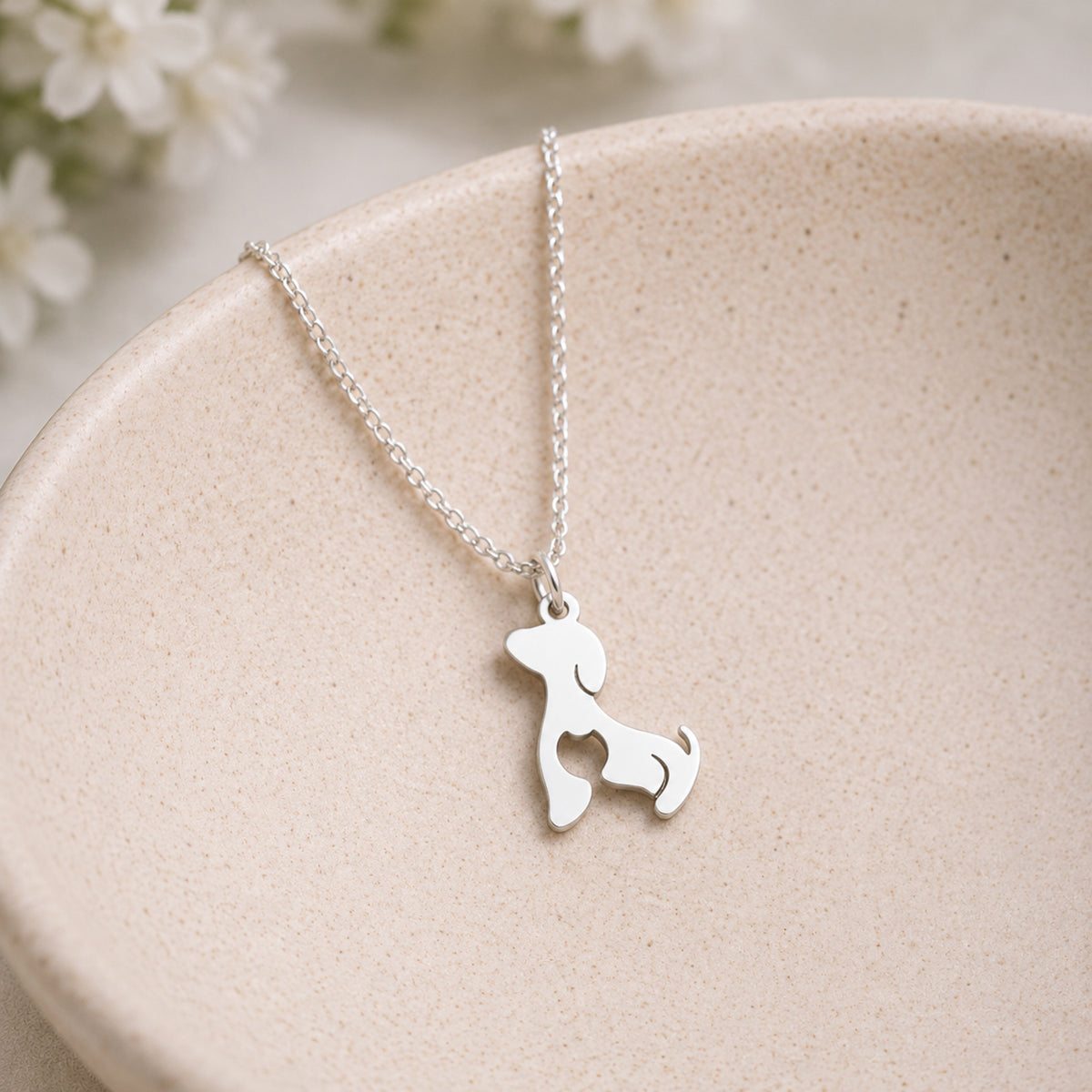 Cat At Heart Dog Necklace - Silver displayed in a lifestyle product photo