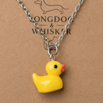 Close up of Rubber Duck Necklace pendant and silver chain