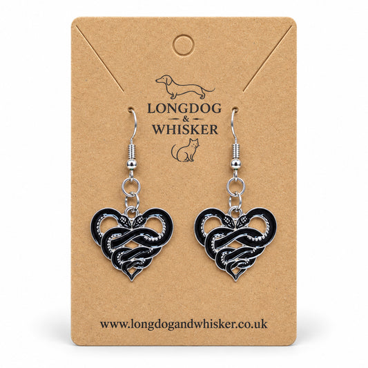 Entwined Snake Heart Drop Earrings displayed on a Longdog & Whisker card