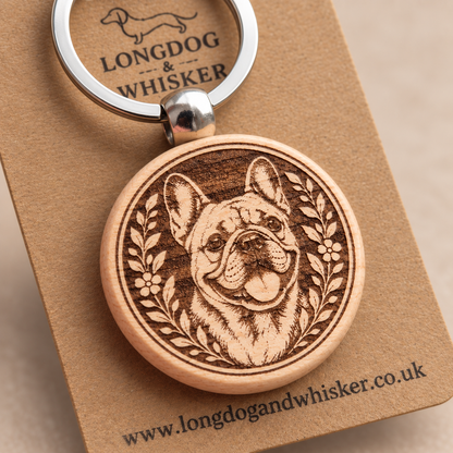 Close-up of the printed French Bulldog wooden keyring and silver-tone hardware