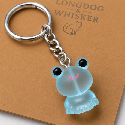 Close-up detail of the Frosted Frog in Aqua Keyring & Bag Charm