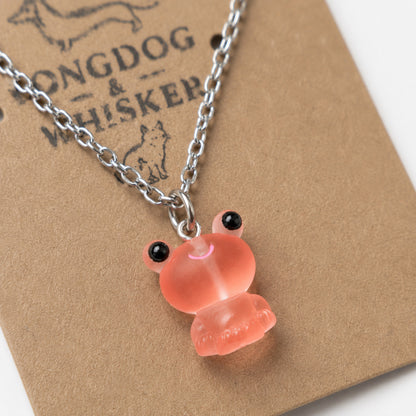 Close-up detail of Frosted Frog in Coral Necklace