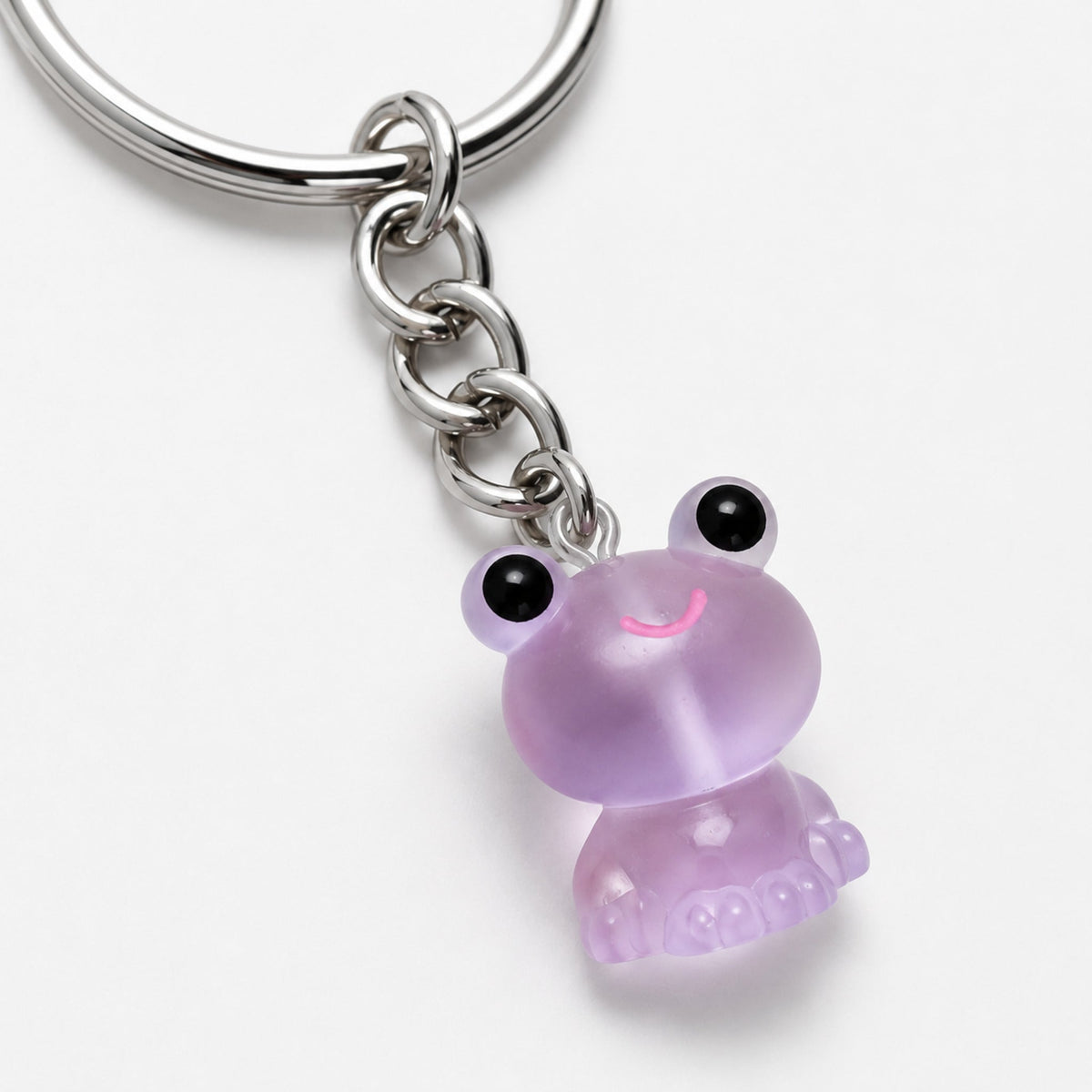 Close-up detail of the Frosted Frog in Lilac Keyring & Bag Charm