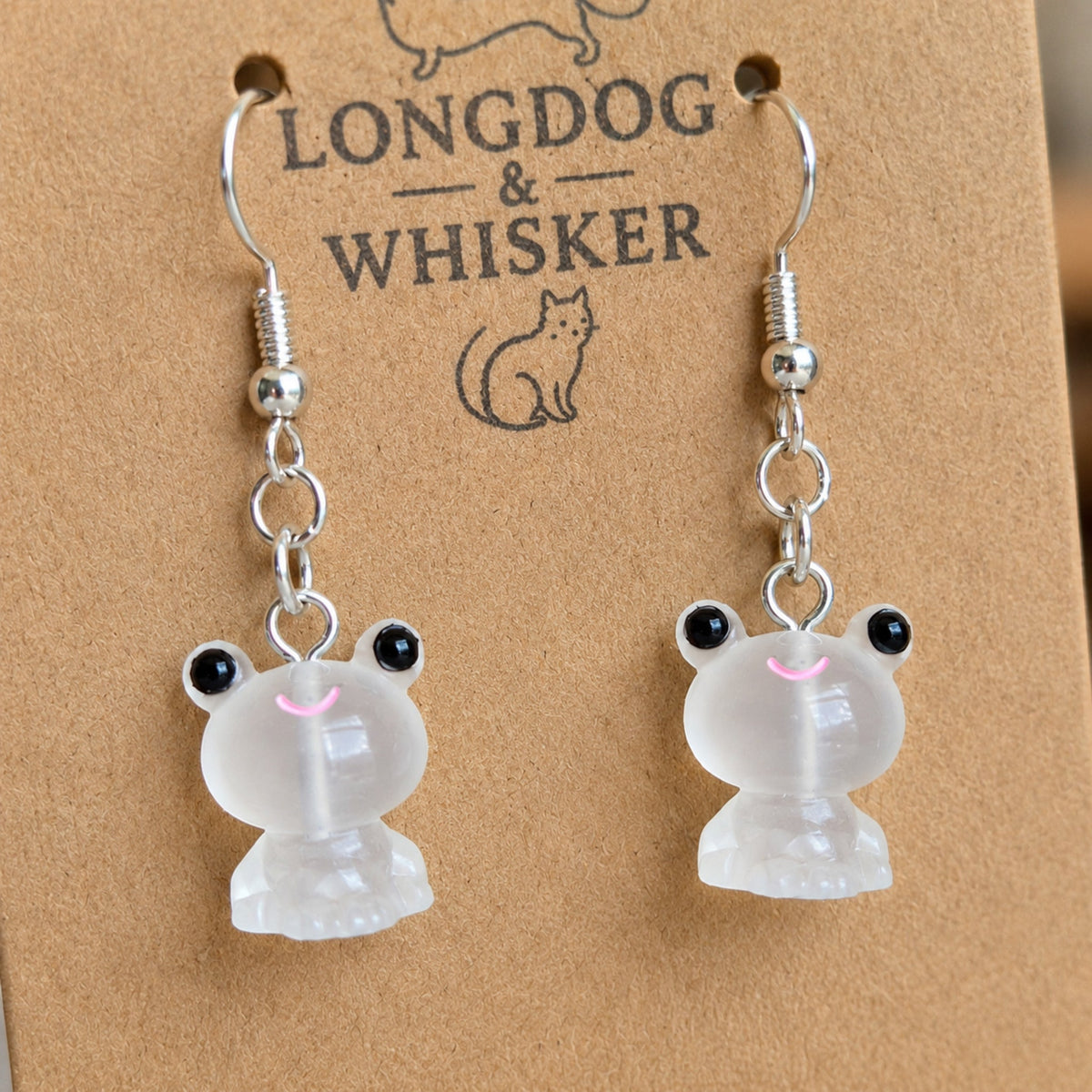 Close-up detail of Frosted Frog in White Earrings