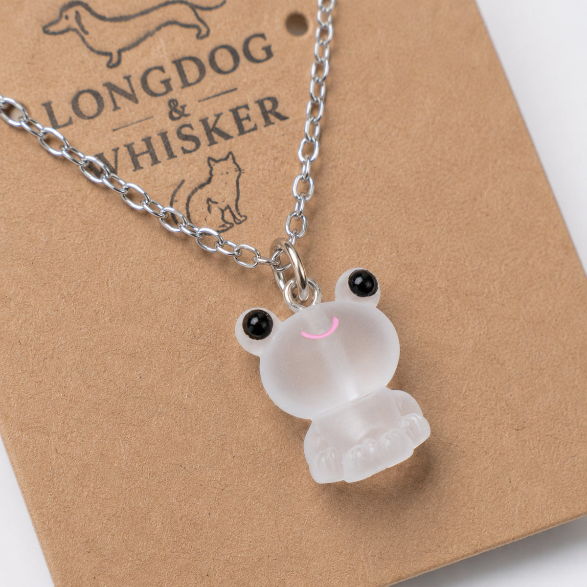 Close-up detail of Frosted Frog in White Necklace