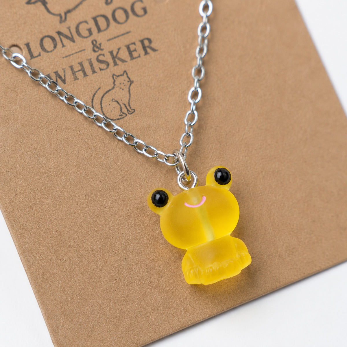 Close-up detail of Frosted Frog in Yellow Necklace
