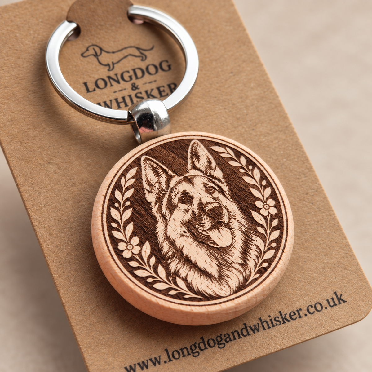 Close-up of the printed German Shepherd wooden keyring and silver-tone hardware