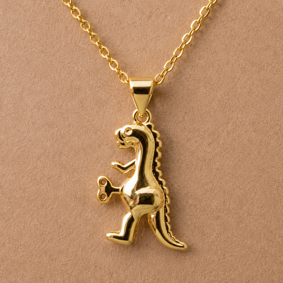 Close-up detail of Clockwork Dinosaur Necklace