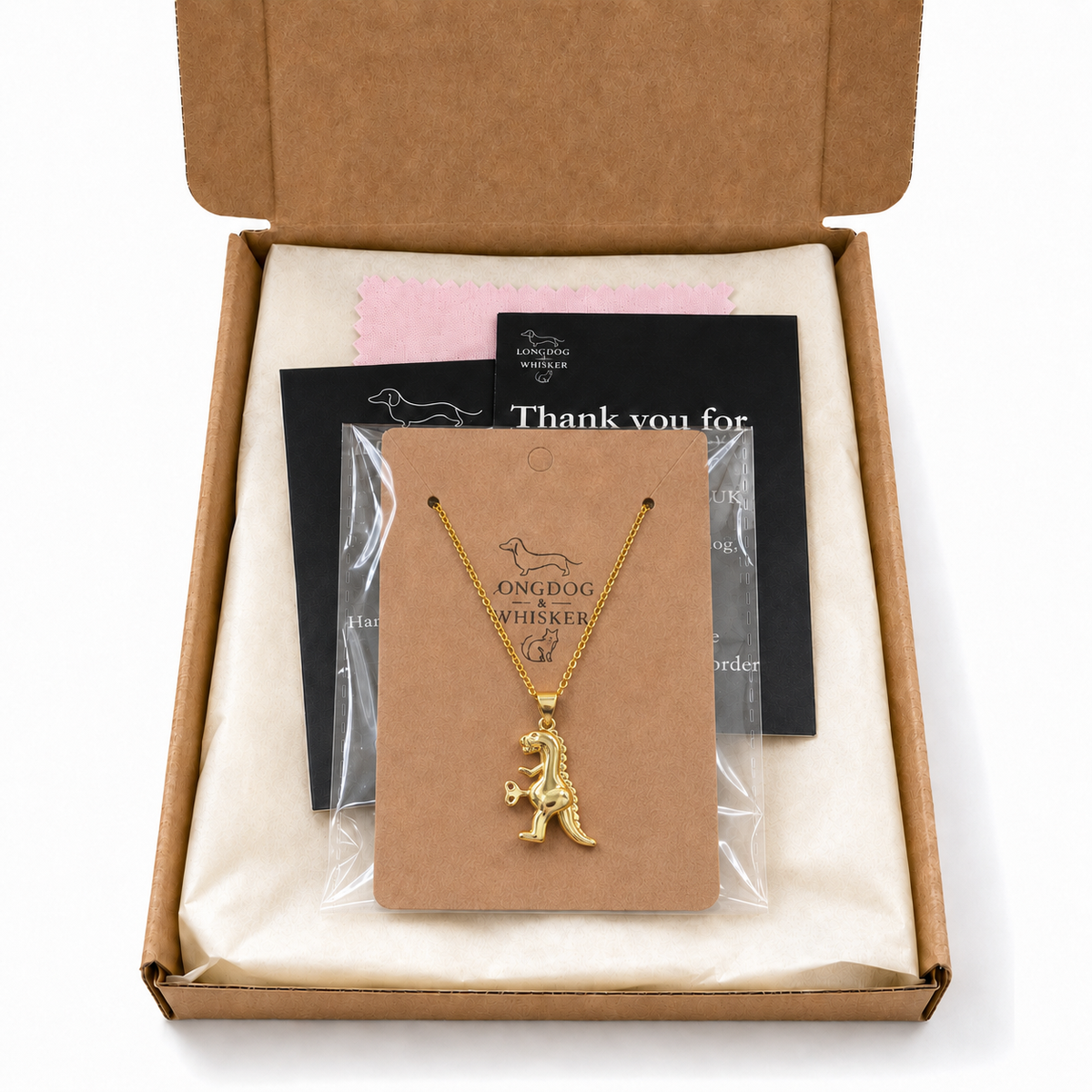 Clockwork Dinosaur Necklace with Longdog & Whisker packaging
