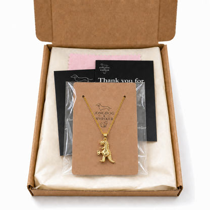 Clockwork Dinosaur Necklace with Longdog & Whisker packaging