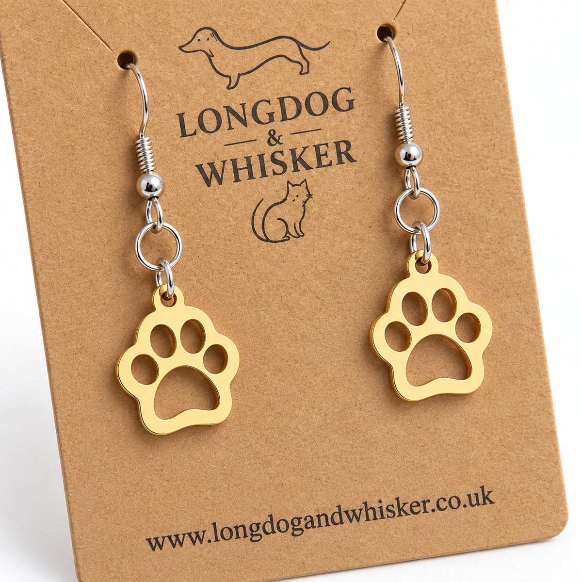 Close-up of gold-tone cut-out paw charms and silver-tone hooks
