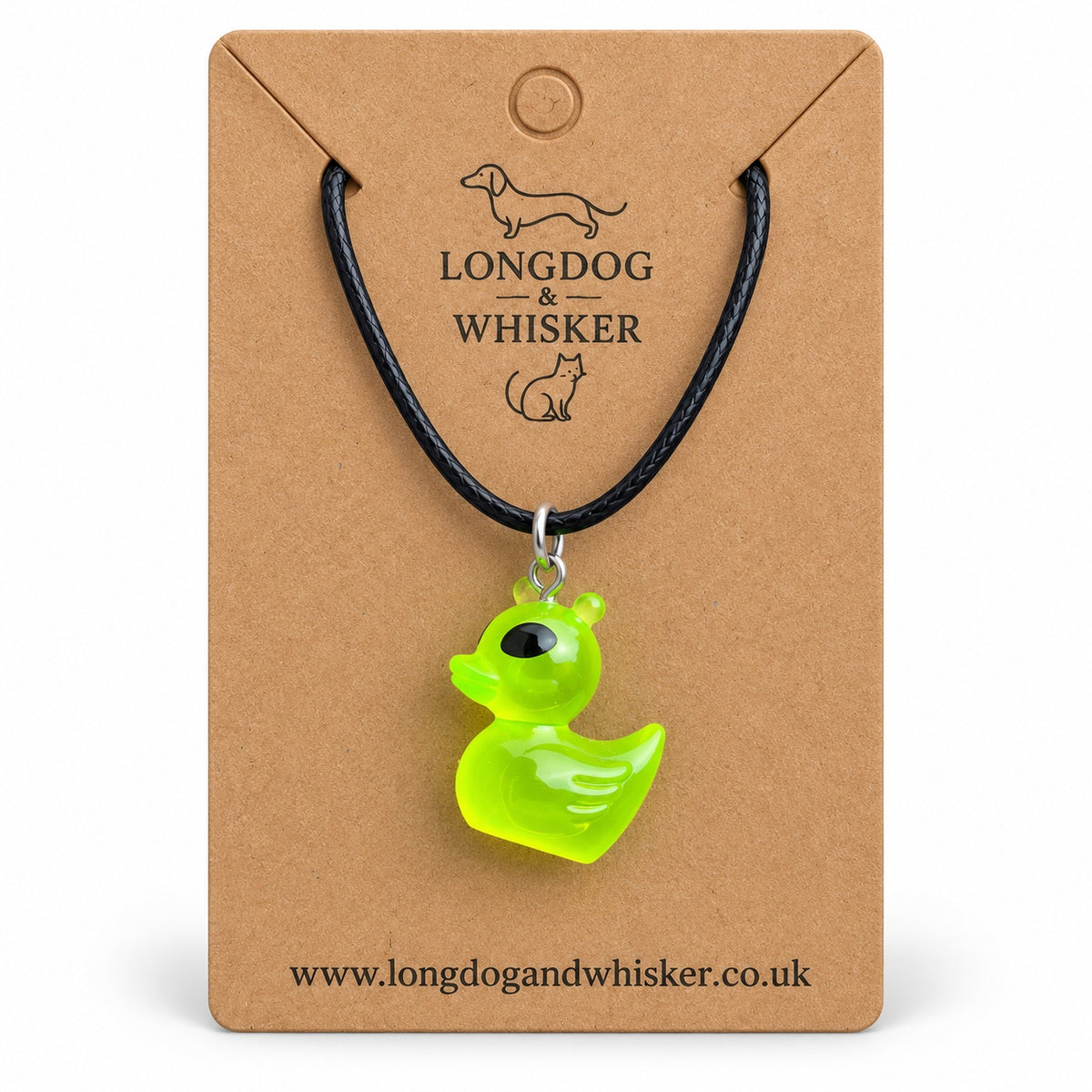Green alien duck necklace on a black cord, displayed on its Longdog & Whisker kraft card