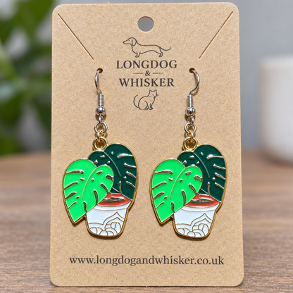 Close-up of Green Monstera Earrings with silver hooks and gold connector rings