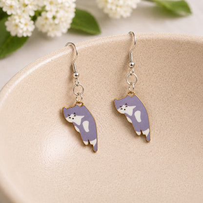 Scruffles Cat Earrings - Grey displayed in a lifestyle product photo