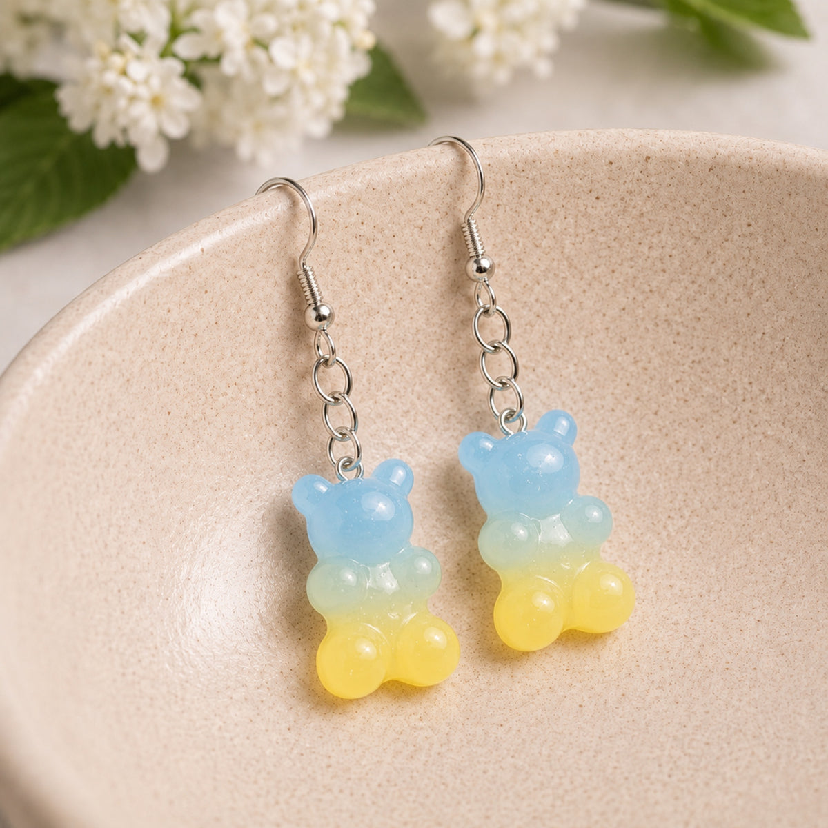 Gummy Bear Earrings - Pale Blue / Yellow displayed in a lifestyle product photo