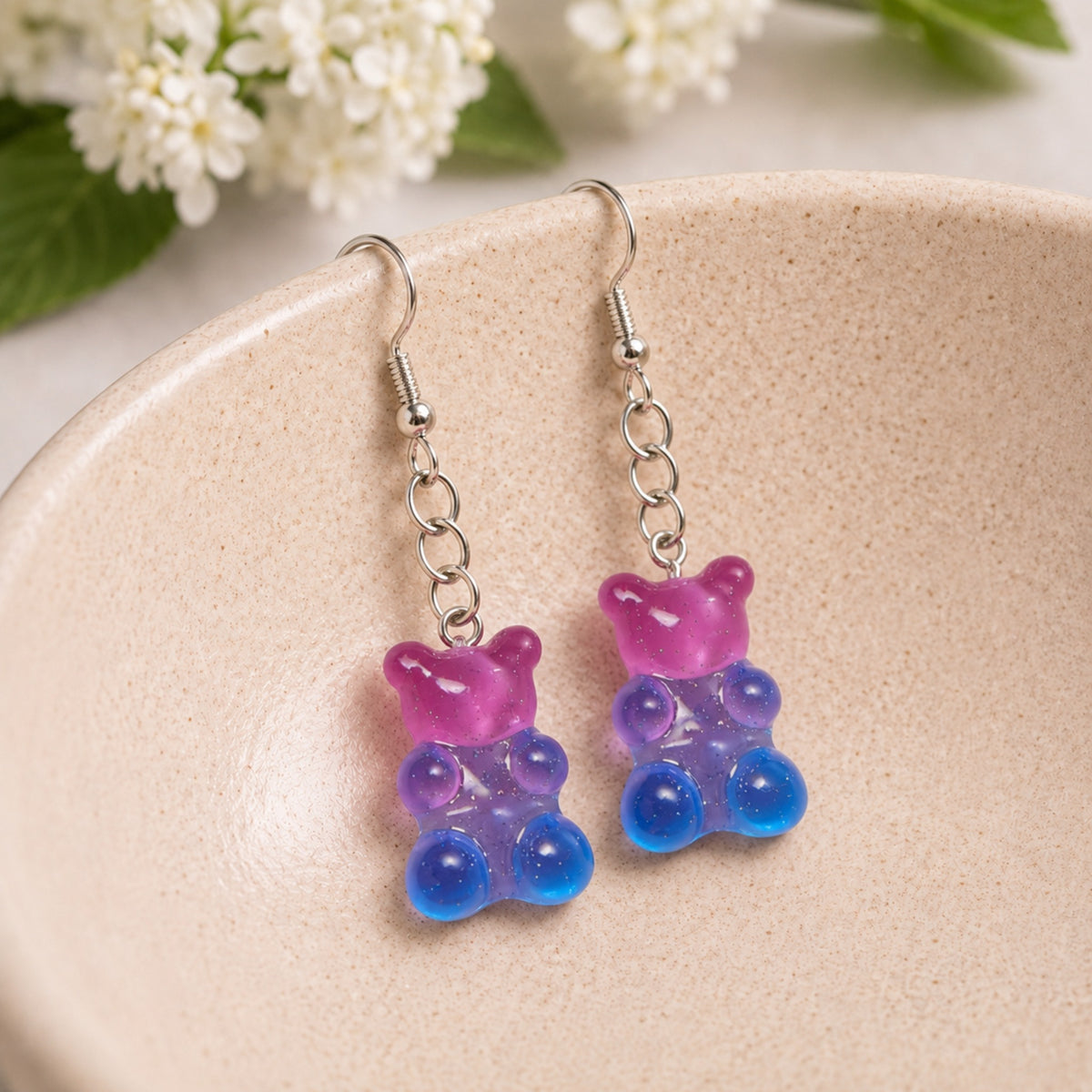 Gummy Bear Earrings - Pink / Clear Blue displayed in a lifestyle product photo