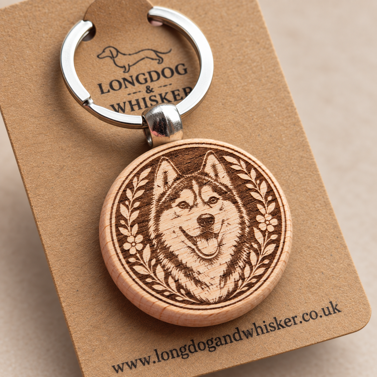 Close-up of the printed Husky wooden keyring and silver-tone hardware