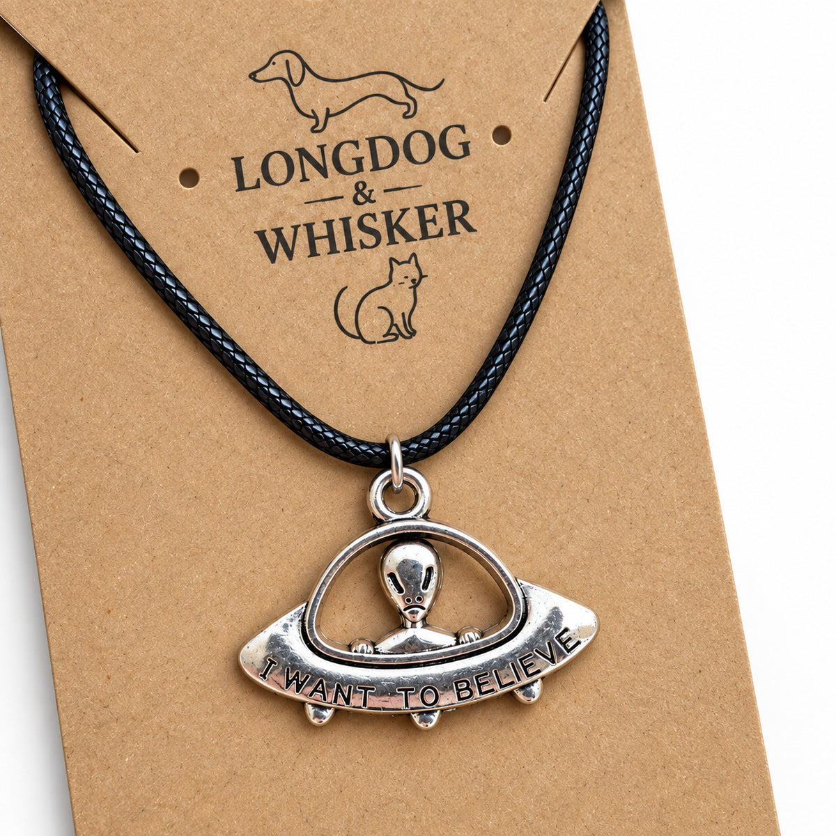 Close-up of I Want to Believe UFO pendant necklace