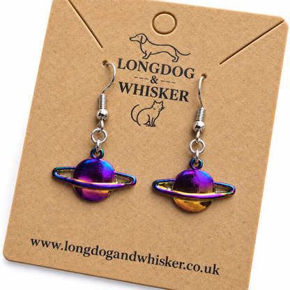 Close detail of iridescent rainbow Saturn planet earrings
